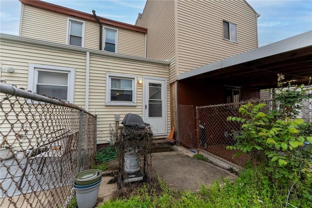 back of house featuring fence