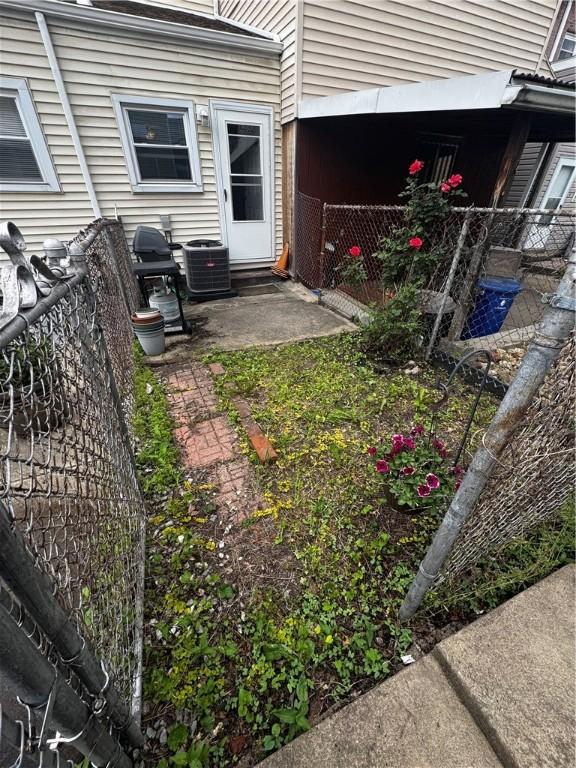 325 Taylor St, Bloomfield, PA 15224 - view of yard featuring central AC and fence