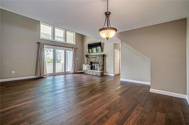 1611 Kenzie Dr, Robinson Twp Nwa, PA 15205 - unfurnished living room featuring dark wood finished floors, baseboards, and a stone fireplace