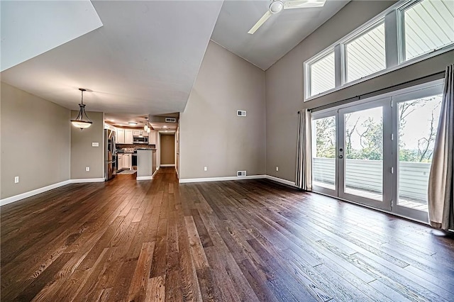 1611 Kenzie Dr, Robinson Twp Nwa, PA 15205 - unfurnished living room featuring dark wood finished floors, a ceiling fan, baseboards, and a towering ceiling