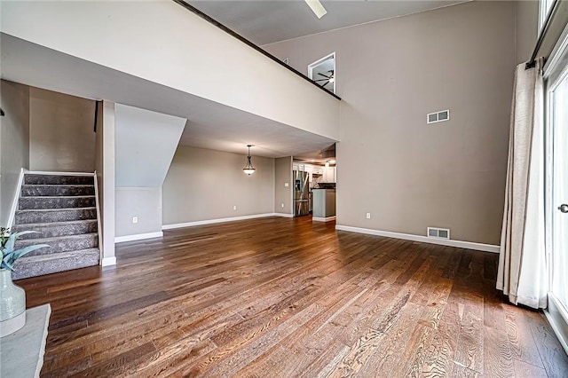 1611 Kenzie Dr, Robinson Twp Nwa, PA 15205 - unfurnished living room featuring wood finished floors, baseboards, and stairway