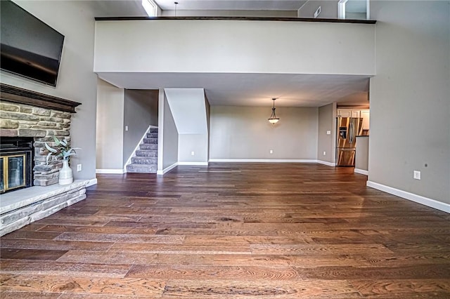 1611 Kenzie Dr, Robinson Twp Nwa, PA 15205 - unfurnished living room with wood finished floors, stairway, and baseboards