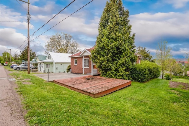 108 Gay St, Salisbury, PA 15558 - back of property featuring a yard, brick siding, and a wooden deck