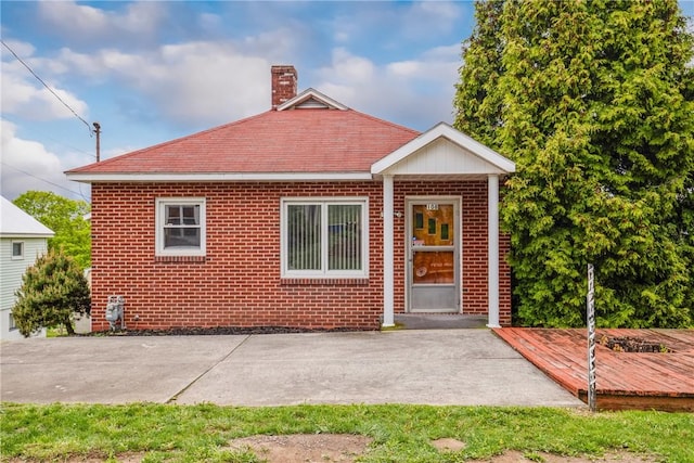 108 Gay St, Salisbury, PA 15558 - view of front facade featuring a patio area, a chimney, and brick siding
