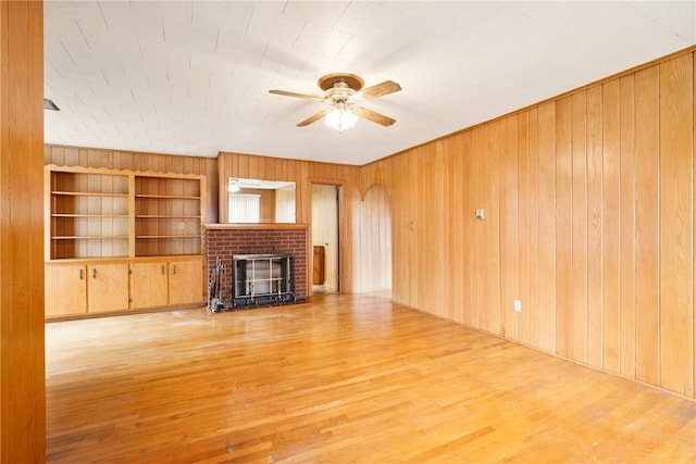 108 Gay St, Salisbury, PA 15558 - unfurnished living room with ceiling fan, wooden walls, wood finished floors, and a fireplace