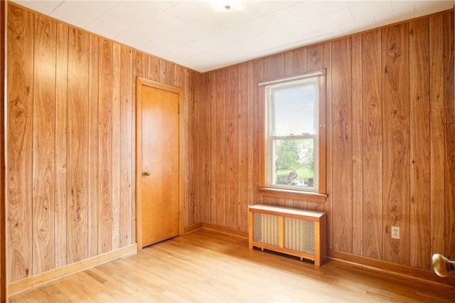 108 Gay St, Salisbury, PA 15558 - spare room featuring radiator heating unit, wood finished floors, wooden walls, and baseboards