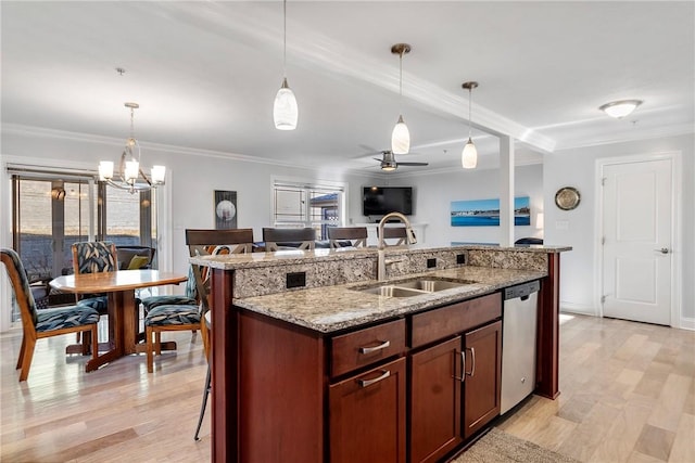 216 Settlers Ct, Peters Twp, PA 15367 - kitchen with a sink, dishwasher, ornamental molding, hanging light fixtures, and light wood-style flooring