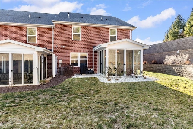 216 Settlers Ct, Peters Twp, PA 15367 - back of house with a sunroom, brick siding, and a yard