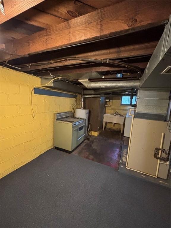 below grade area with a sink and washer / dryer