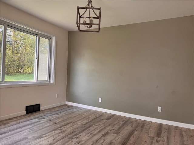 1350 George St, Hermitage, PA 16148 - unfurnished room featuring a chandelier, baseboards, and wood finished floors