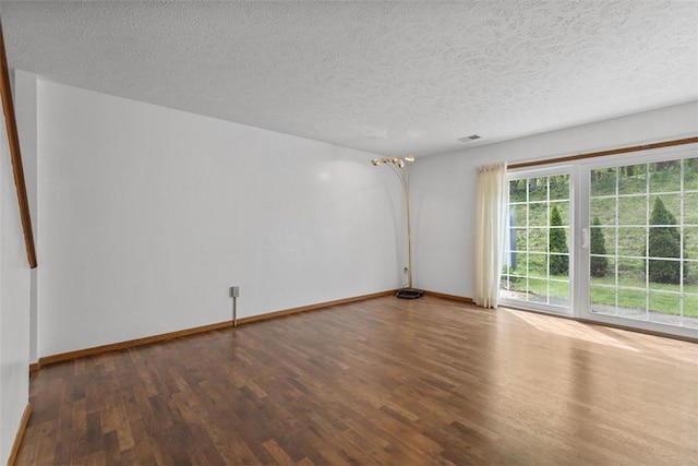567 Brandywine Dr, Cranberry Twp, PA 16066 - spare room featuring wood finished floors, a textured ceiling, and baseboards