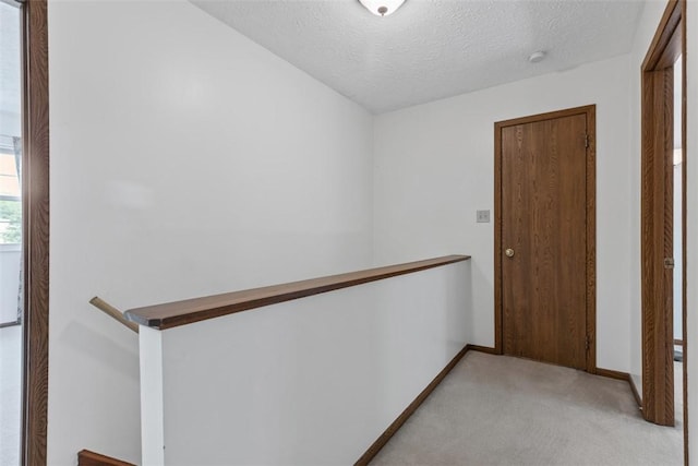 567 Brandywine Dr, Cranberry Twp, PA 16066 - hallway with an upstairs landing, light colored carpet, a textured ceiling, and baseboards