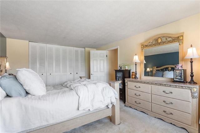 bedroom with light carpet and a closet