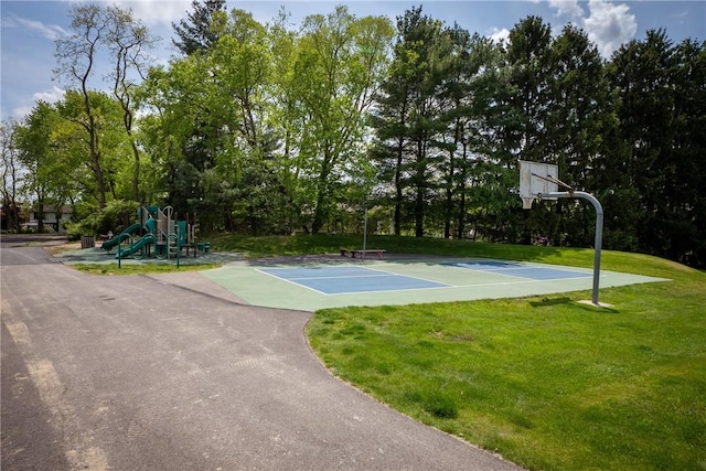 view of basketball court with a yard and community basketball court