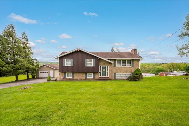 118 Francis St, Bentleyville, PA 15314 - bi-level home featuring asphalt driveway, a chimney, a front lawn, a garage, and entry steps