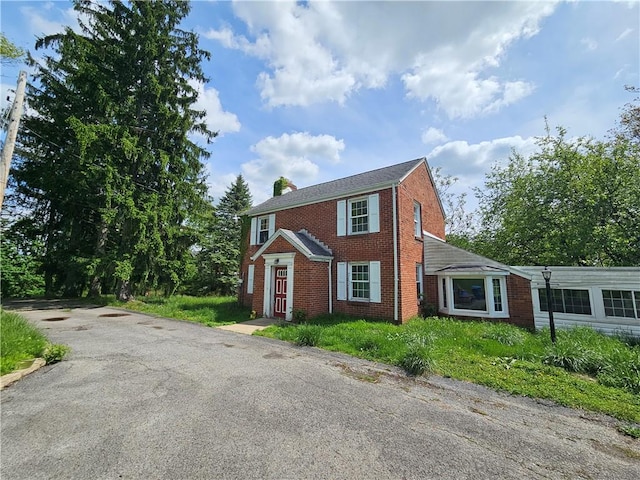 256 Duff Rd, Penn Hills, PA 15235 - view of front of property featuring brick siding and a chimney