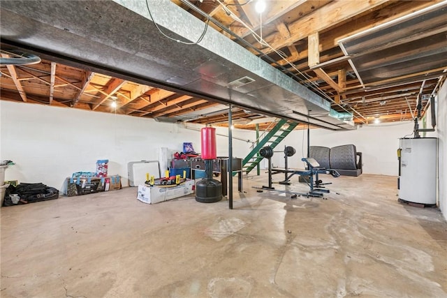 unfinished below grade area featuring water heater