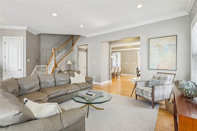 1241 Newbury Highland, South Fayette, PA 15017 - living room featuring stairway, light wood-style flooring, crown molding, recessed lighting, and healthy amount of natural light