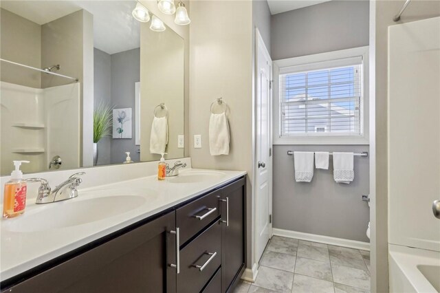 1241 Newbury Highland, South Fayette, PA 15017 - bathroom featuring marble finish floors, double vanity, baseboards, and toilet