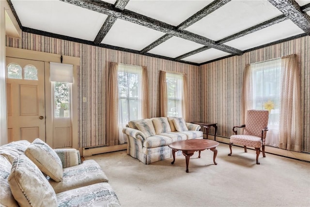 living area with wallpapered walls, coffered ceiling, plenty of natural light, carpet, and beam ceiling