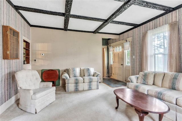 carpeted living room featuring wallpapered walls, coffered ceiling, and beamed ceiling