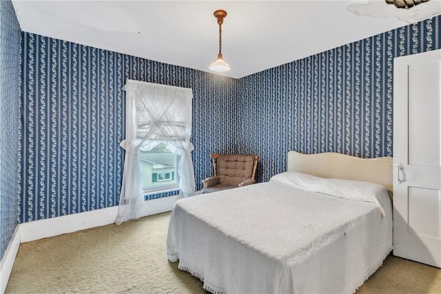 bedroom featuring wallpapered walls and carpet flooring