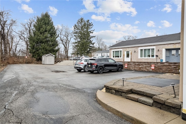 uncovered parking lot with a storage unit