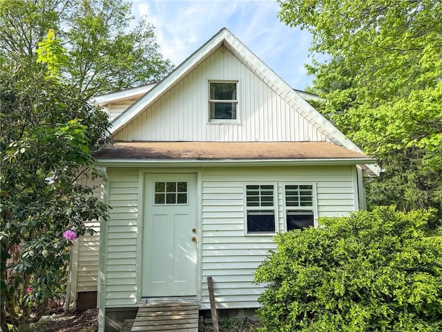 155 Elm St, Saint Clair Twp, PA 15954 - rear view of house with a shingled roof, entry steps, and board and batten siding