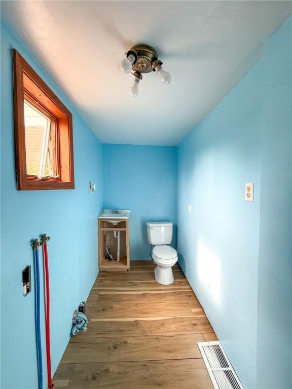 155 Elm St, Saint Clair Twp, PA 15954 - bathroom featuring toilet and wood finished floors