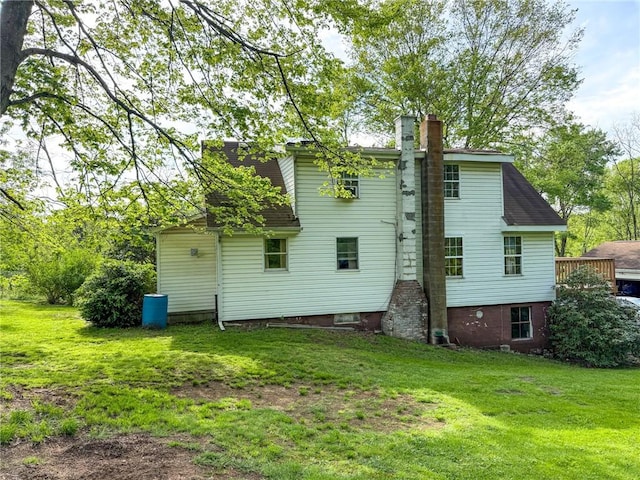 155 Elm St, Saint Clair Twp, PA 15954 - back of property with a chimney and a lawn