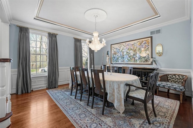 904 Champlain Pl, Adams Twp, PA 15044 - dining area with a tray ceiling, a chandelier, wood finished floors, wainscoting, and a decorative wall