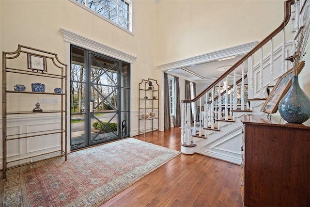 904 Champlain Pl, Adams Twp, PA 15044 - foyer entrance featuring stairway, wood finished floors, a high ceiling, and ornamental molding