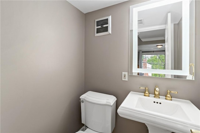 half bath with a sink and toilet