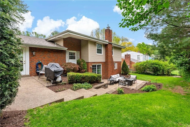 back of property with an outdoor living space, a patio, brick siding, and a chimney