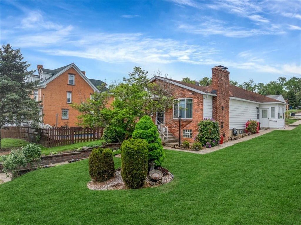 1225 2nd St, Jefferson Hills, PA 15025 - rear view of house featuring brick siding and a chimney