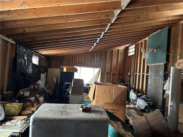 miscellaneous room featuring plenty of natural light and lofted ceiling