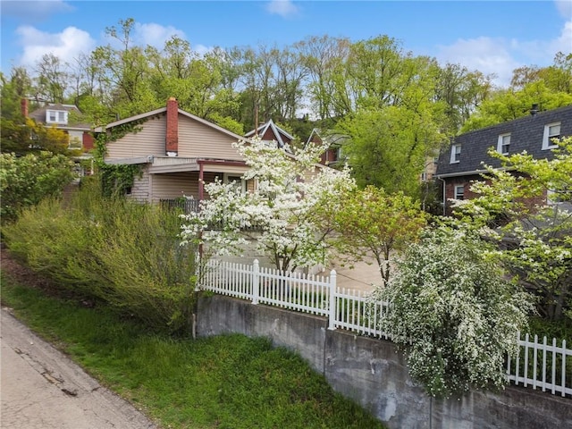 obstructed view of property featuring fence