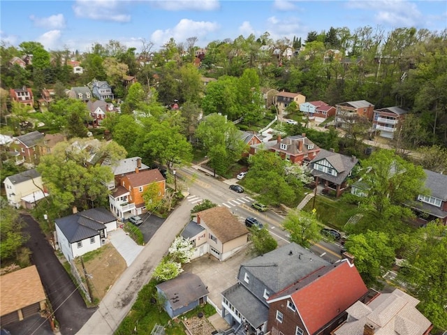 aerial view of residential area with a tree filled landscape