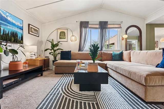 living area with carpet flooring, crown molding, and vaulted ceiling