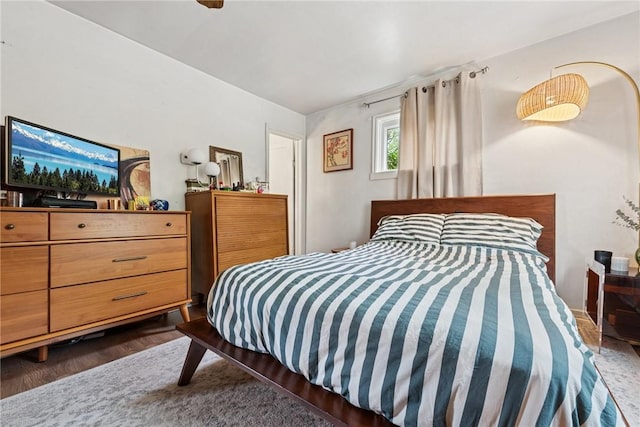 bedroom featuring wood finished floors