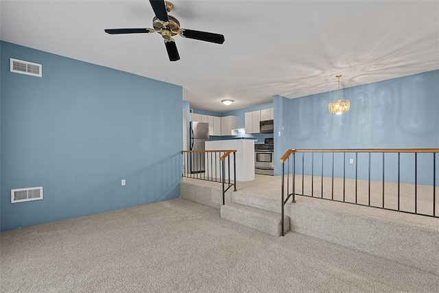 1406 Kenzie Dr, Robinson Twp Nwa, PA 15205 - empty room featuring light carpet, a ceiling fan, and a chandelier