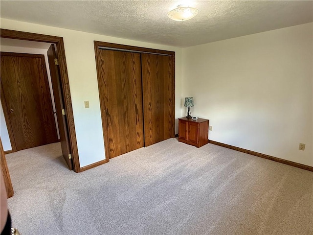 111 Mccall Rd, Franklin Twp But, PA 16001 - unfurnished bedroom featuring a closet, carpet flooring, a textured ceiling, and baseboards