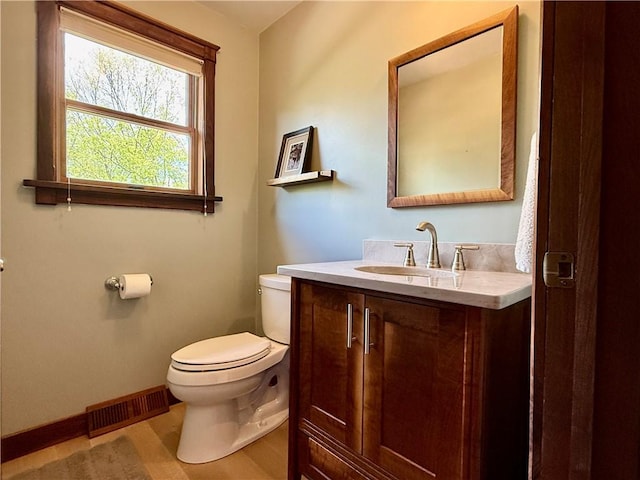 111 Mccall Rd, Franklin Twp But, PA 16001 - half bath featuring toilet, baseboards, and vanity