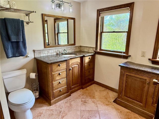 111 Mccall Rd, Franklin Twp But, PA 16001 - bathroom featuring healthy amount of natural light, vanity, toilet, and baseboards