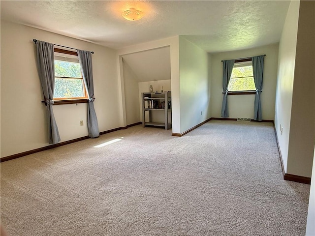 111 Mccall Rd, Franklin Twp But, PA 16001 - bonus room featuring light colored carpet, a textured ceiling, and baseboards