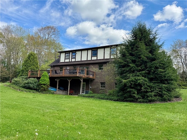 111 Mccall Rd, Franklin Twp But, PA 16001 - back of property with a wooden deck, a lawn, and brick siding