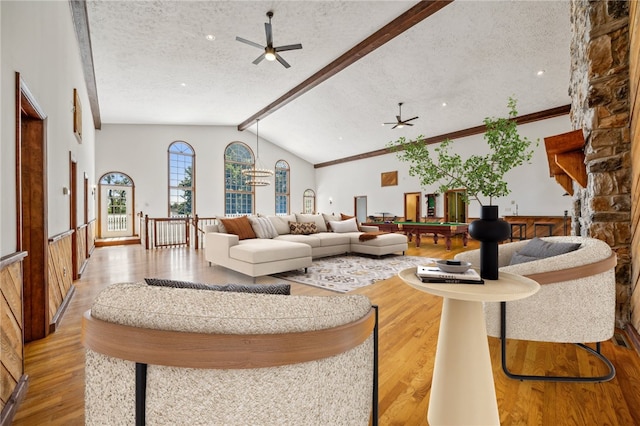 living room with a ceiling fan, a textured ceiling, wood finished floors, and billiards table