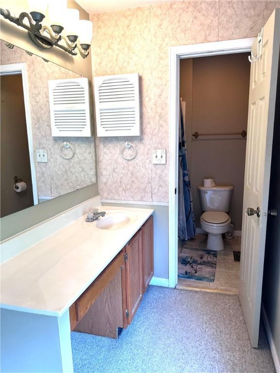 491 Peregrine Dr, North Huntingdon, PA 15642 - bathroom with toilet and vanity