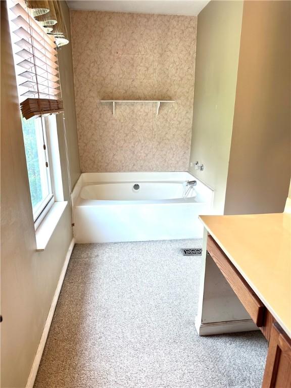 491 Peregrine Dr, North Huntingdon, PA 15642 - bathroom featuring a tub and a shower