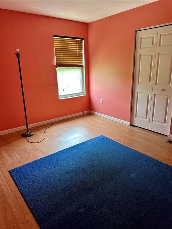 491 Peregrine Dr, North Huntingdon, PA 15642 - unfurnished bedroom with wood finished floors and baseboards